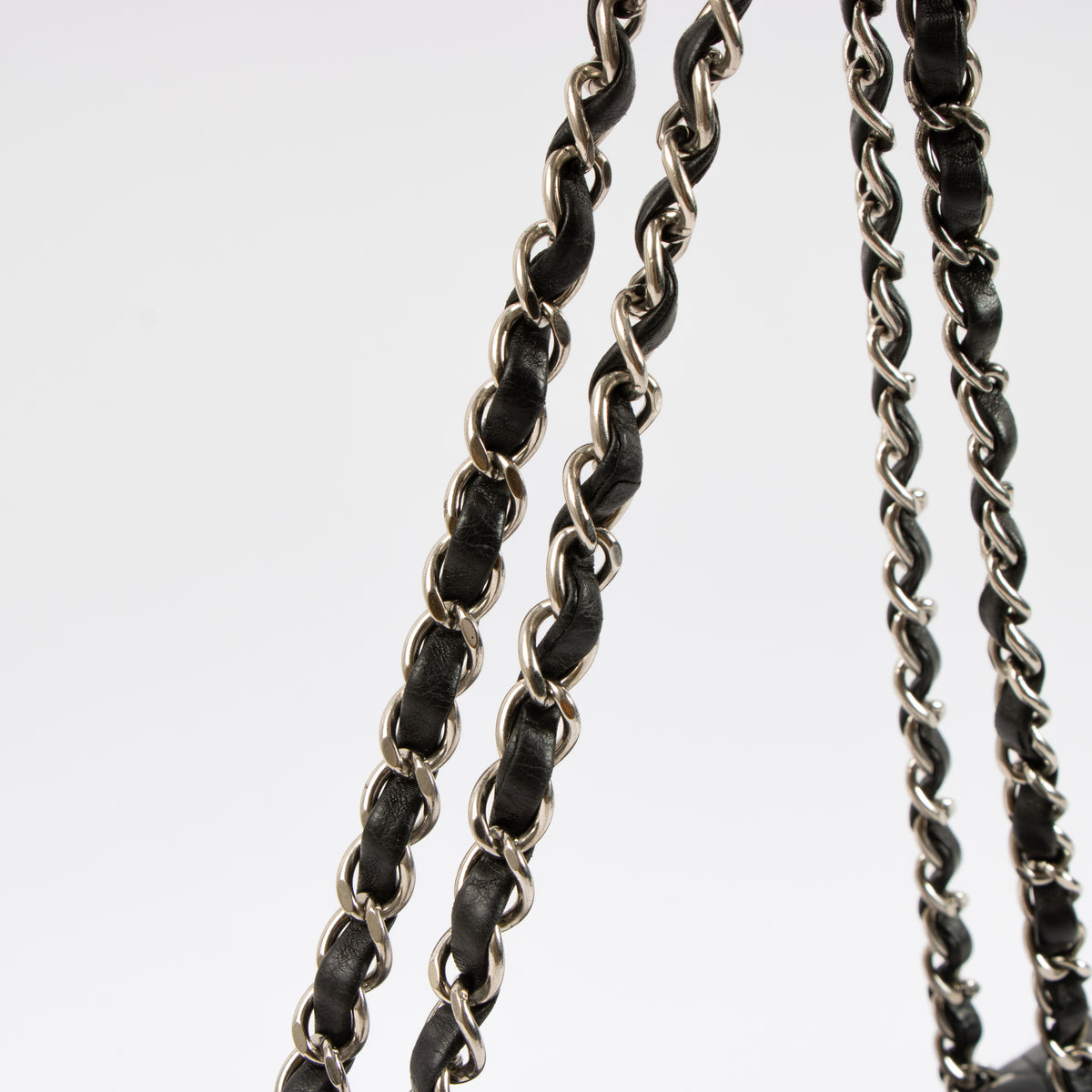 Shop this authentic Chanel Black Lambskin Medium Classic 11.12 Handbag pre-loved on Labellov.com