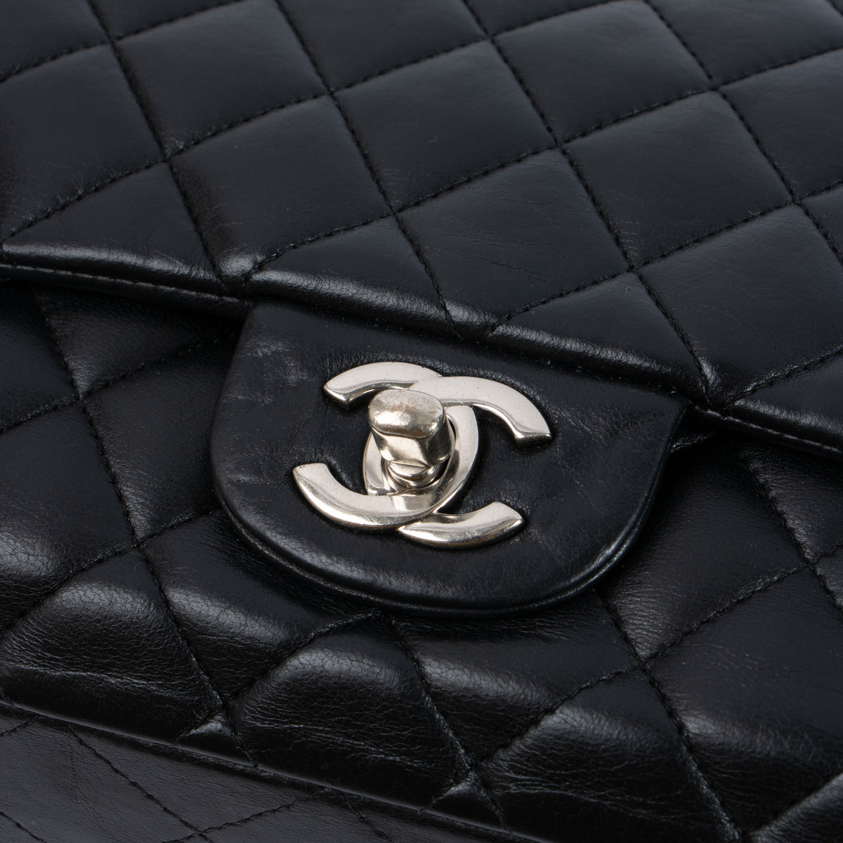 Shop this authentic Chanel Black Lambskin Medium Classic 11.12 Handbag pre-loved on Labellov.com