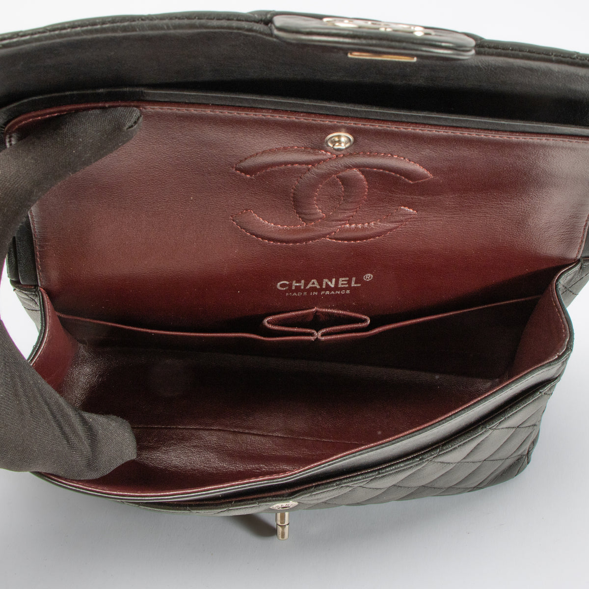 Shop this authentic Chanel Black Lambskin Medium Classic 11.12 Handbag pre-loved on Labellov.com
