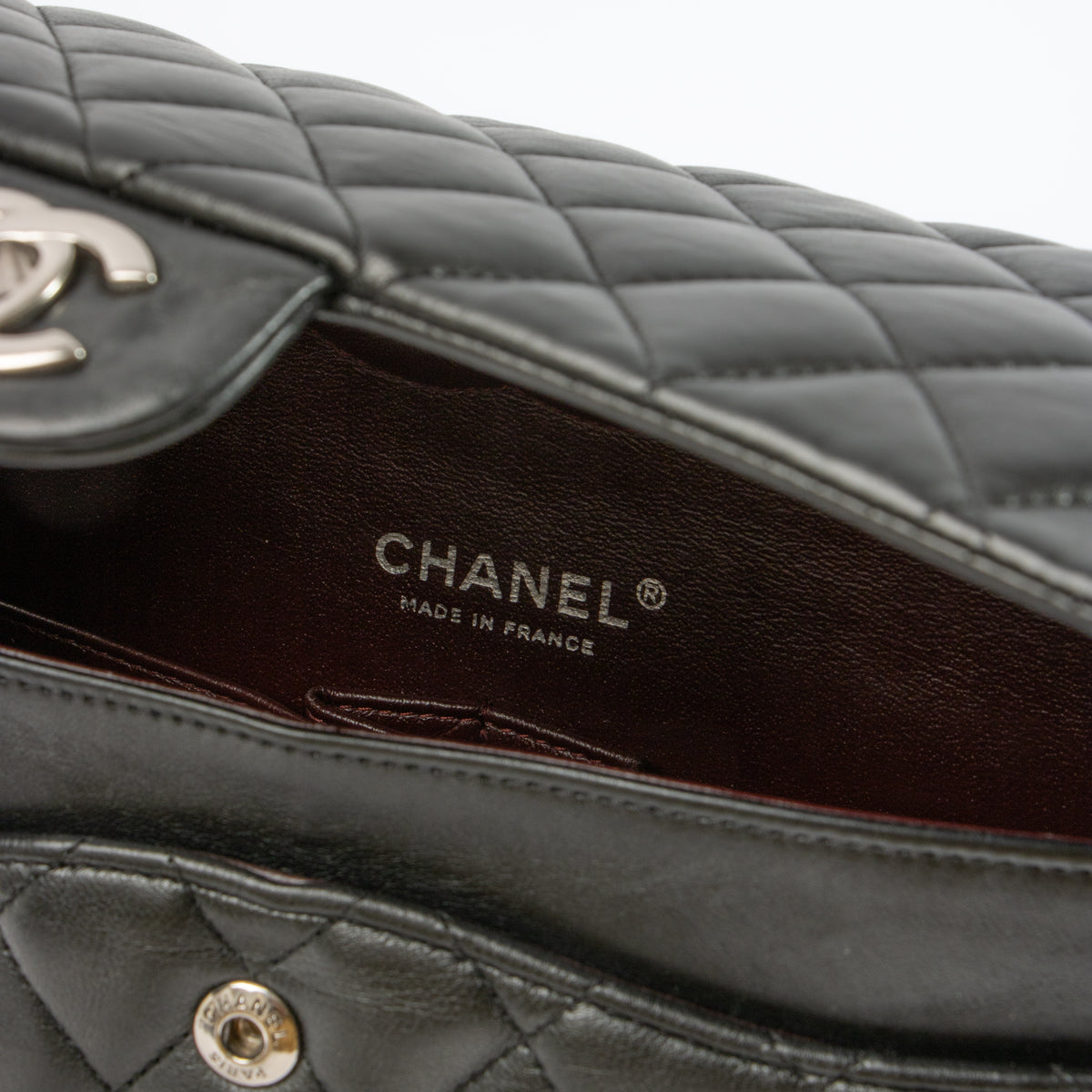 Shop this authentic Chanel Black Lambskin Medium Classic 11.12 Handbag pre-loved on Labellov.com