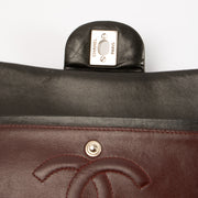 Shop this authentic Chanel Black Lambskin Medium Classic 11.12 Handbag pre-loved on Labellov.com