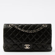 Shop this authentic Chanel Black Lambskin Medium Classic 11.12 Handbag pre-loved on Labellov.com