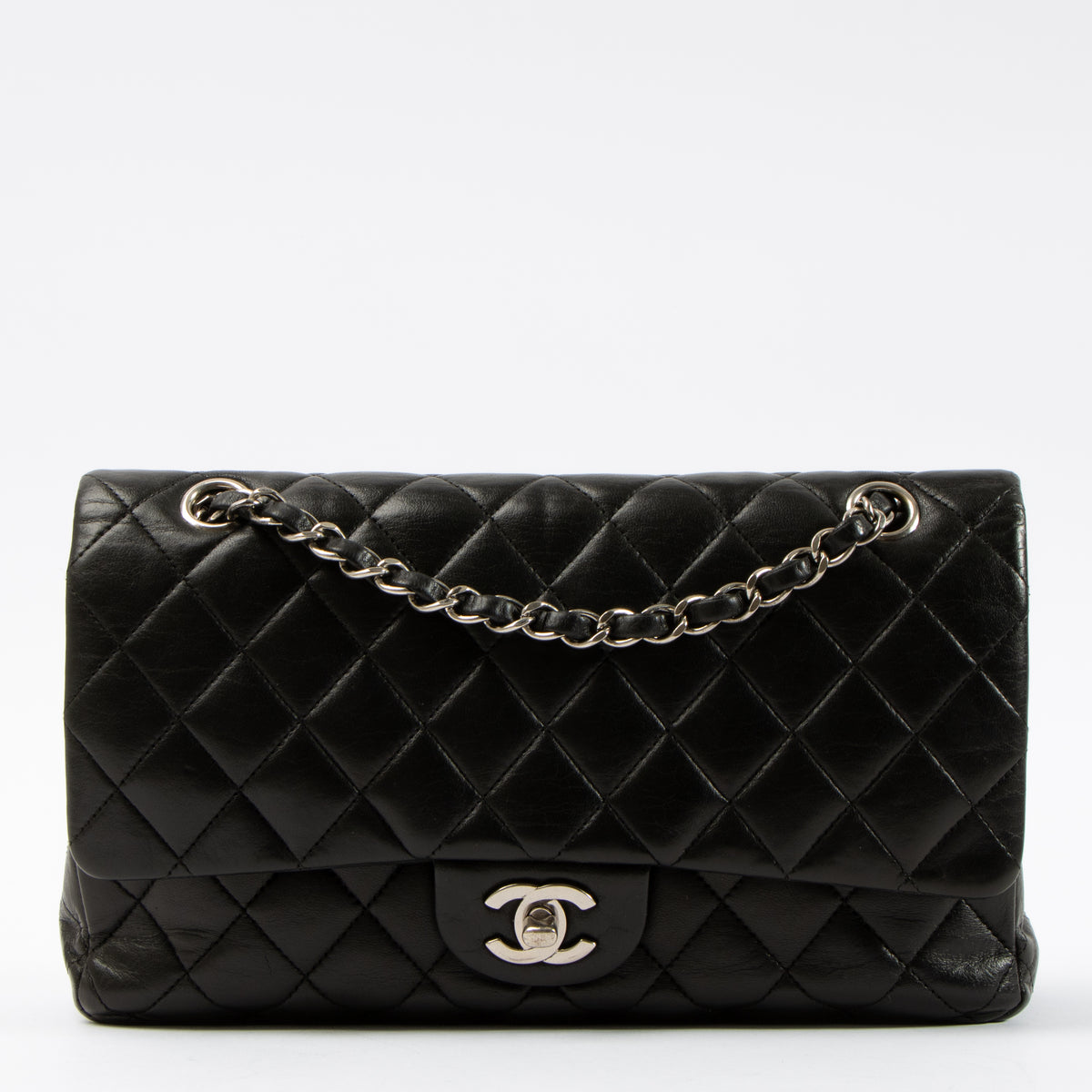 Shop this authentic Chanel Black Lambskin Medium Classic 11.12 Handbag pre-loved on Labellov.com