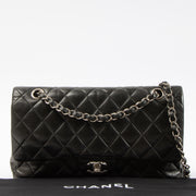 Shop this authentic Chanel Black Lambskin Medium Classic 11.12 Handbag pre-loved on Labellov.com