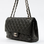 Shop this authentic Chanel Black Lambskin Medium Classic 11.12 Handbag pre-loved on Labellov.com