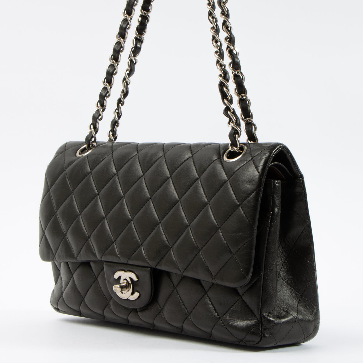 Shop this authentic Chanel Black Lambskin Medium Classic 11.12 Handbag pre-loved on Labellov.com