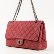 Shop this authentic Chanel Framboise Matte Caviar Maxi 2.55 Reissue Bag Pre-Loved on Labellov.com