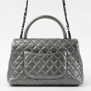 Shop this authentic Chanel Metallic Grey Medium Coco Handle Bag pre-loved on Labellov.com