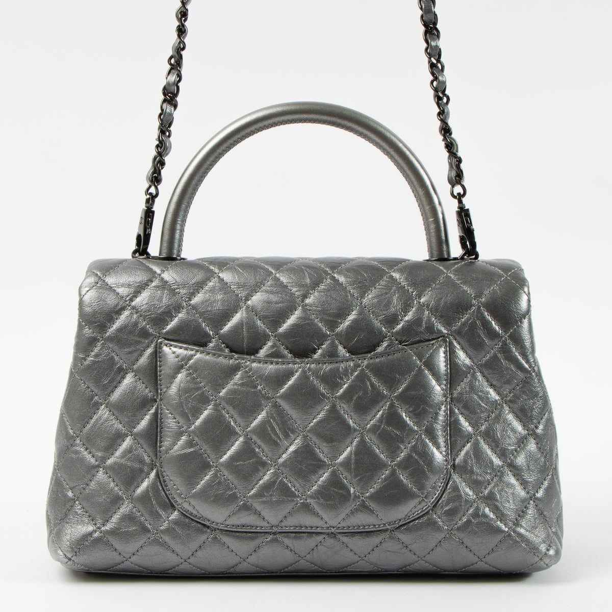 Shop this authentic Chanel Metallic Grey Medium Coco Handle Bag pre-loved on Labellov.com