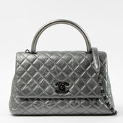 Shop this authentic Chanel Metallic Grey Medium Coco Handle Bag pre-loved on Labellov.com