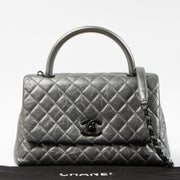 Shop this authentic Chanel Metallic Grey Medium Coco Handle Bag pre-loved on Labellov.com