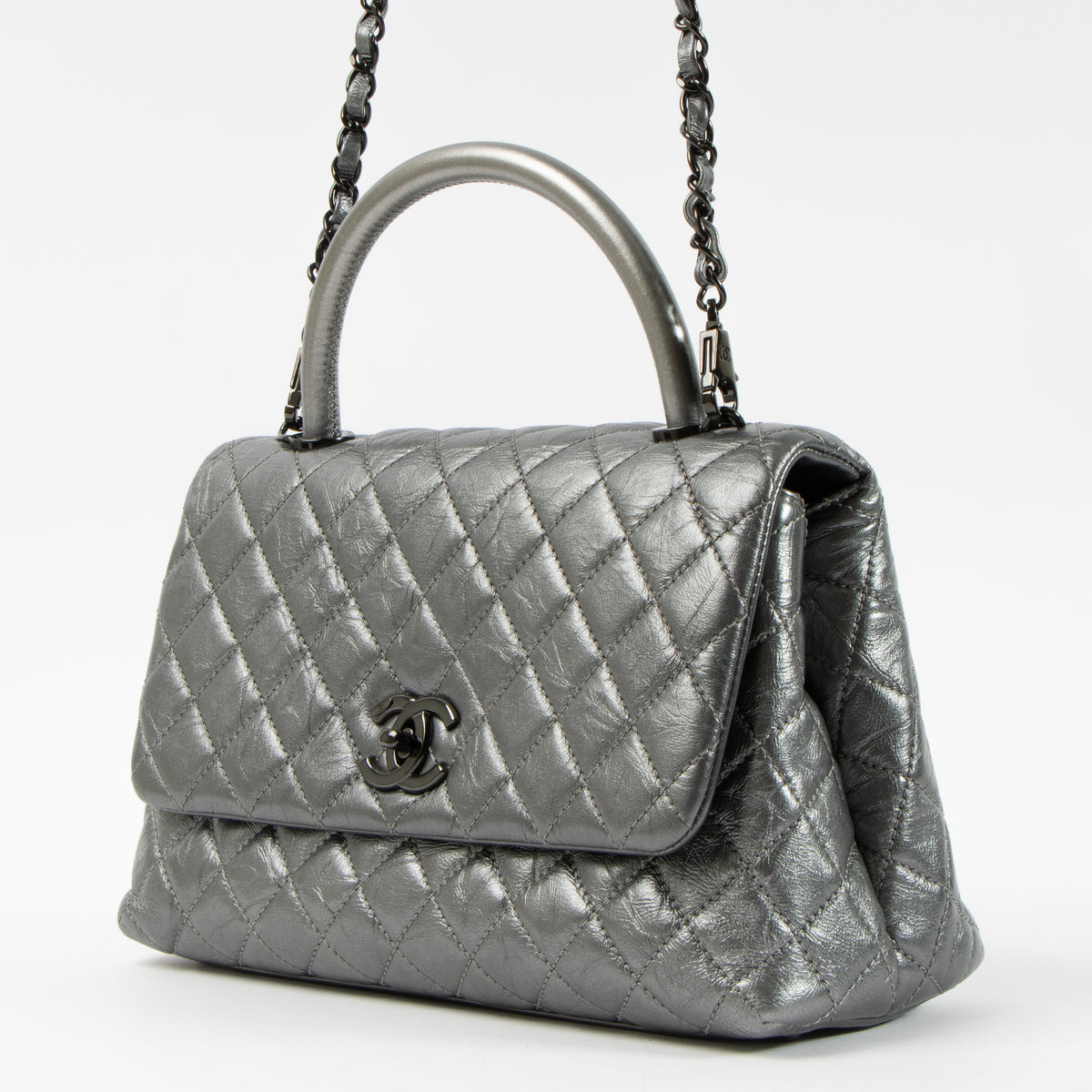 Shop this authentic Chanel Metallic Grey Medium Coco Handle Bag pre-loved on Labellov.com