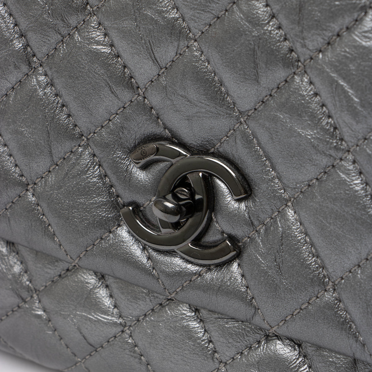 Shop this authentic Chanel Metallic Grey Medium Coco Handle Bag pre-loved on Labellov.com