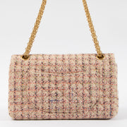 Shop this authentic Chanel Pink Tweed Medium 2.55 Reissue Bag pre-loved on Labellov.com
