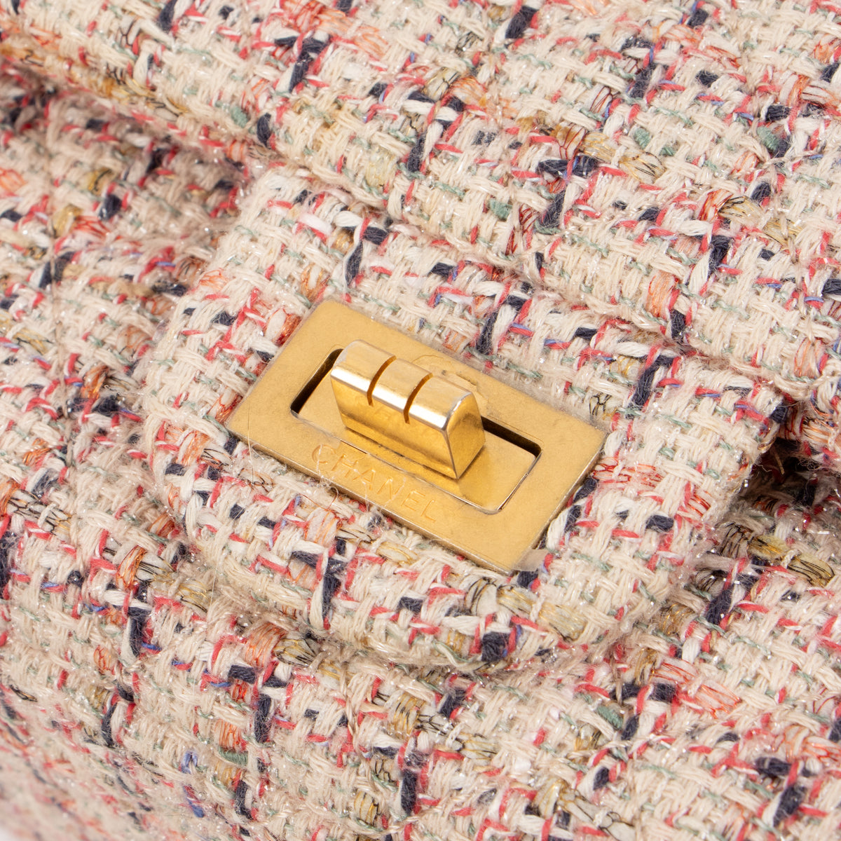 Shop this authentic Chanel Pink Tweed Medium 2.55 Reissue Bag pre-loved on Labellov.com