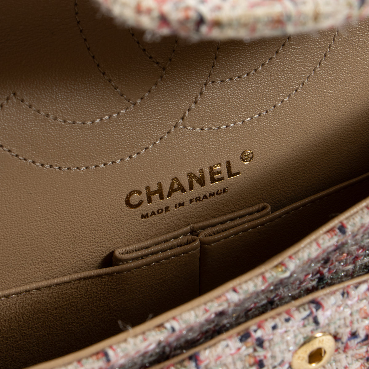 Shop this authentic Chanel Pink Tweed Medium 2.55 Reissue Bag pre-loved on Labellov.com