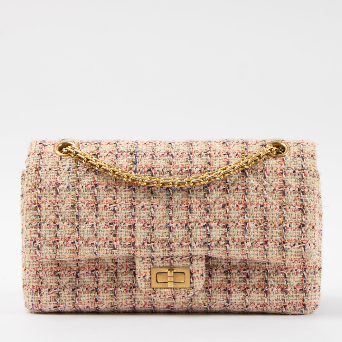 Shop this authentic Chanel Pink Tweed Medium 2.55 Reissue Bag pre-loved on Labellov.com