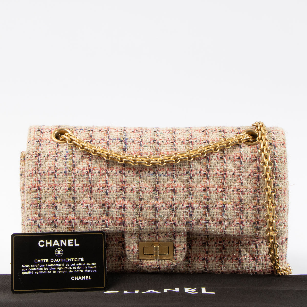Shop this authentic Chanel Pink Tweed Medium 2.55 Reissue Bag pre-loved on Labellov.com