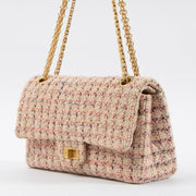 Shop this authentic Chanel Pink Tweed Medium 2.55 Reissue Bag pre-loved on Labellov.com