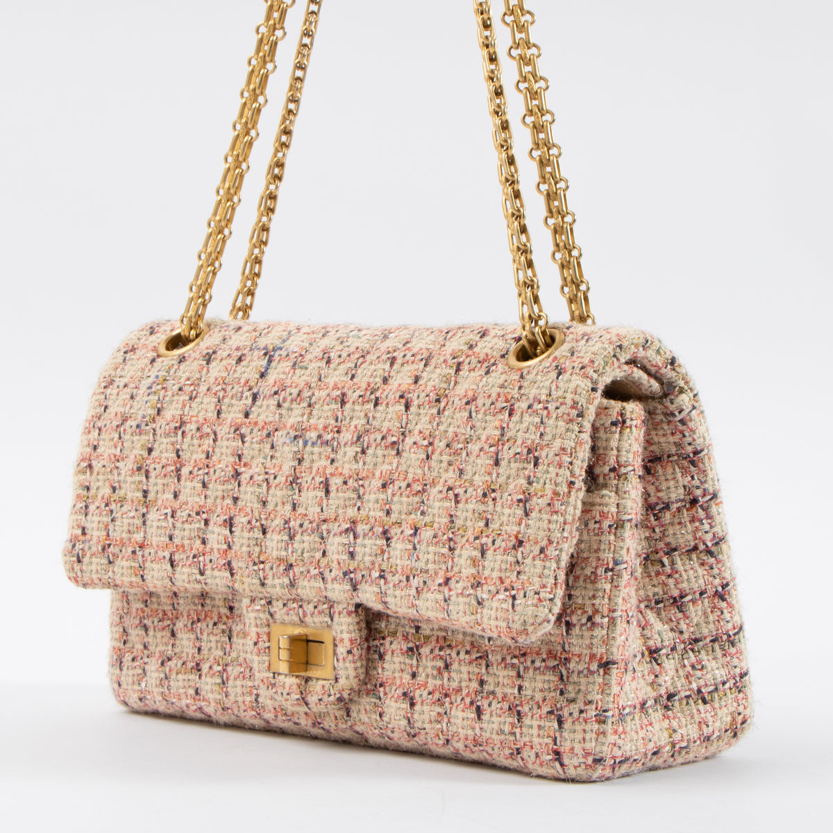 Shop this authentic Chanel Pink Tweed Medium 2.55 Reissue Bag pre-loved on Labellov.com