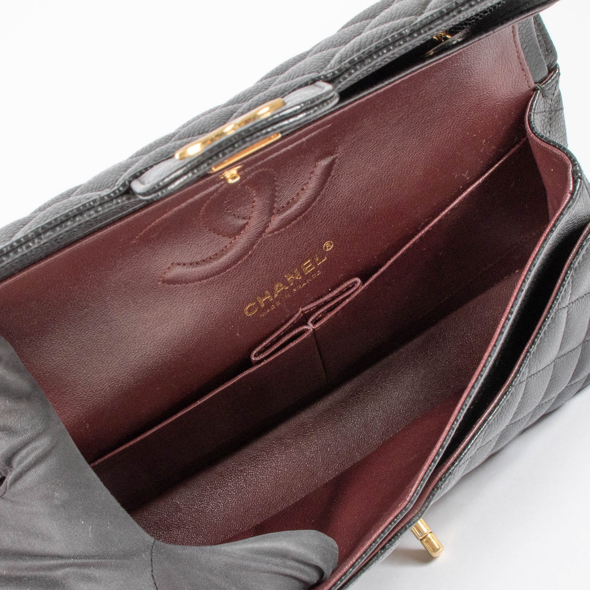 Shop this authentic Chanel Black Caviar Medium Classic 11.12 Handbag pre-loved on Labellov.com