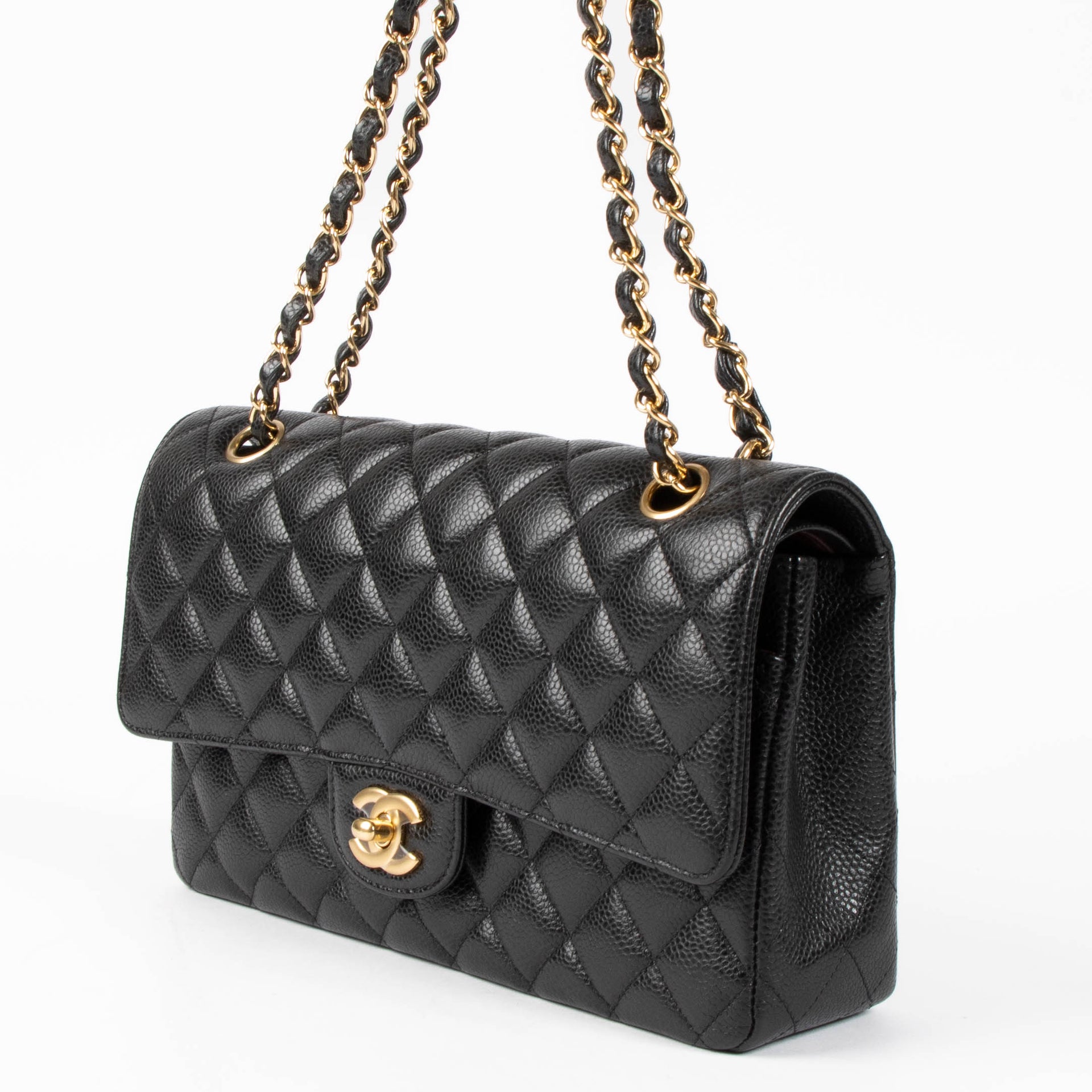 Shop this authentic Chanel Black Caviar Medium Classic 11.12 Handbag pre-loved on Labellov.com