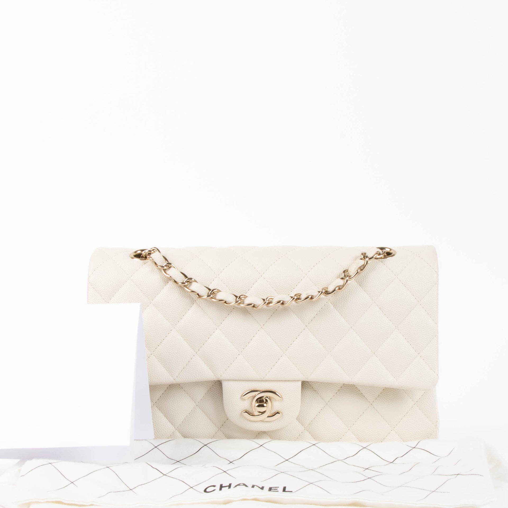 Shop the authentic Chanel Ecru Caviar Medium Classic 11.12 Shoulder Bag second hand on Labellov.com