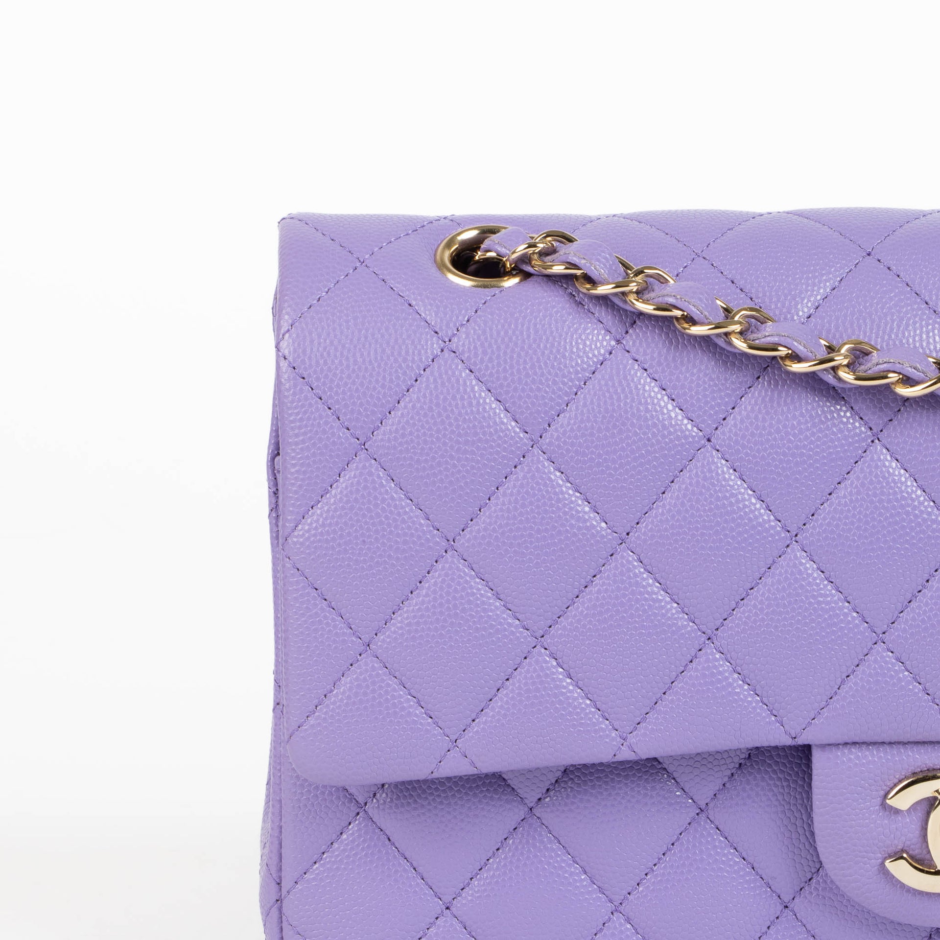 Shop this 100% authentic Chanel Purple Caviar Medium Classic 11.12 Handbag at Labellov.com