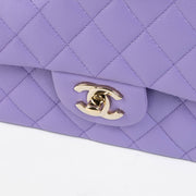 Shop this 100% authentic Chanel Purple Caviar Medium Classic 11.12 Handbag at Labellov.com