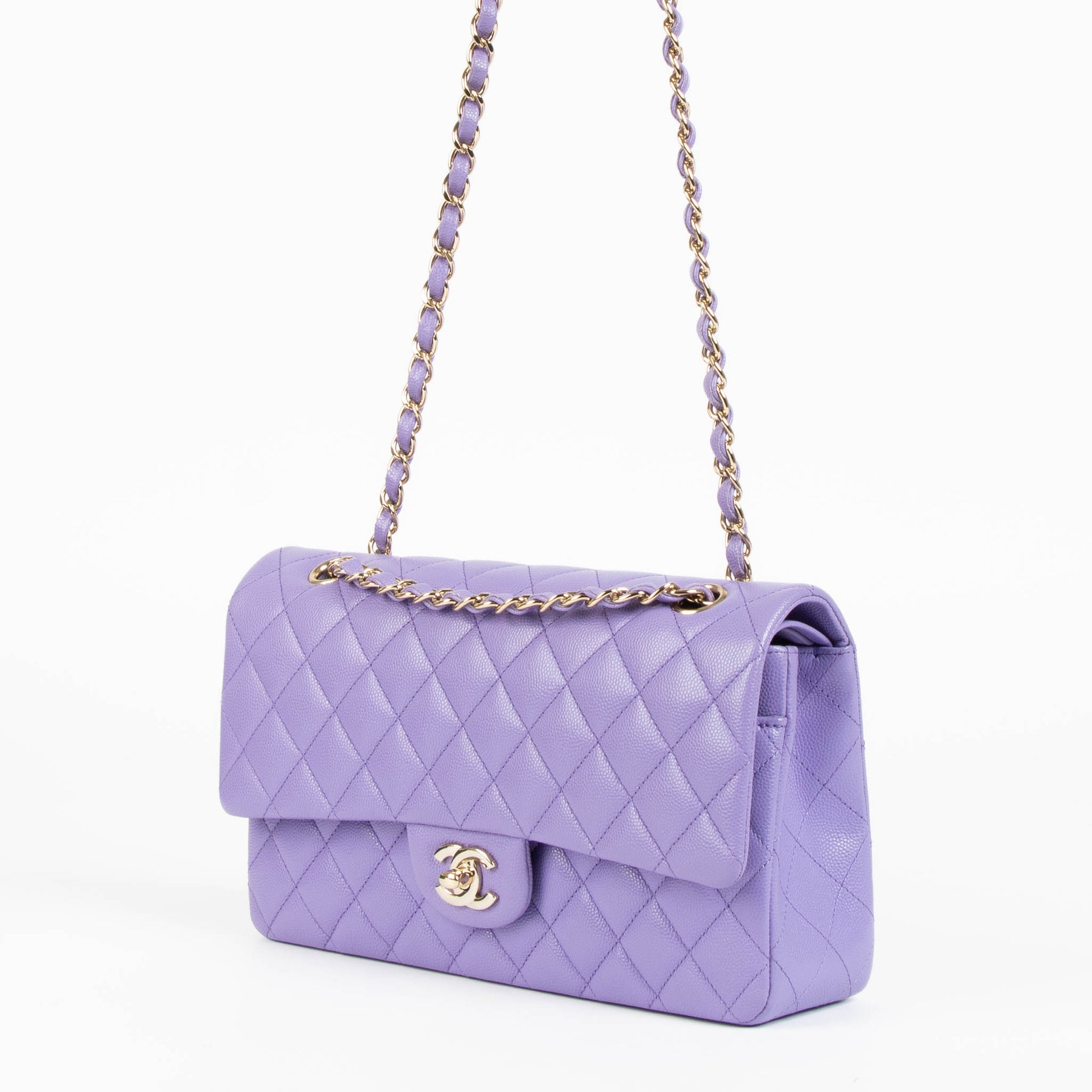 Shop this 100% authentic Chanel Purple Caviar Medium Classic 11.12 Handbag at Labellov.com