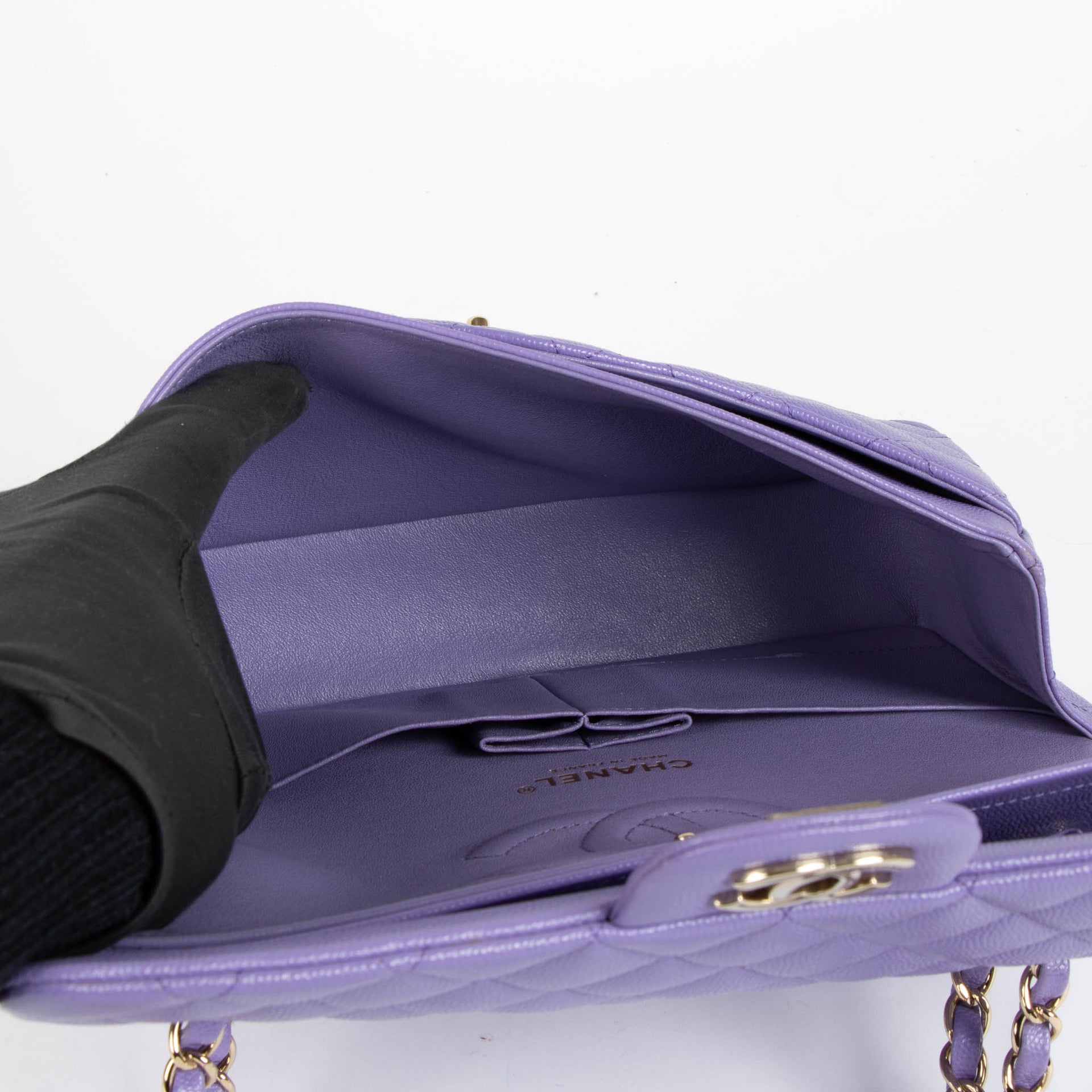Shop this 100% authentic Chanel Purple Caviar Medium Classic 11.12 Handbag at Labellov.com