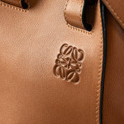 Shop the authentic Loewe Tan Medium Hammock Bag second hand on Labellov.com