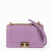 Shop this 100% authentic Chanel Boy Medium Purple Caviar Bag at Labellov.com