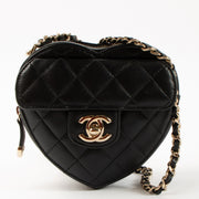 Shop this authentic Chanel Black Quilted Lambskin CC In Love Heart Clutch With Chain pre-loved on labellov.com