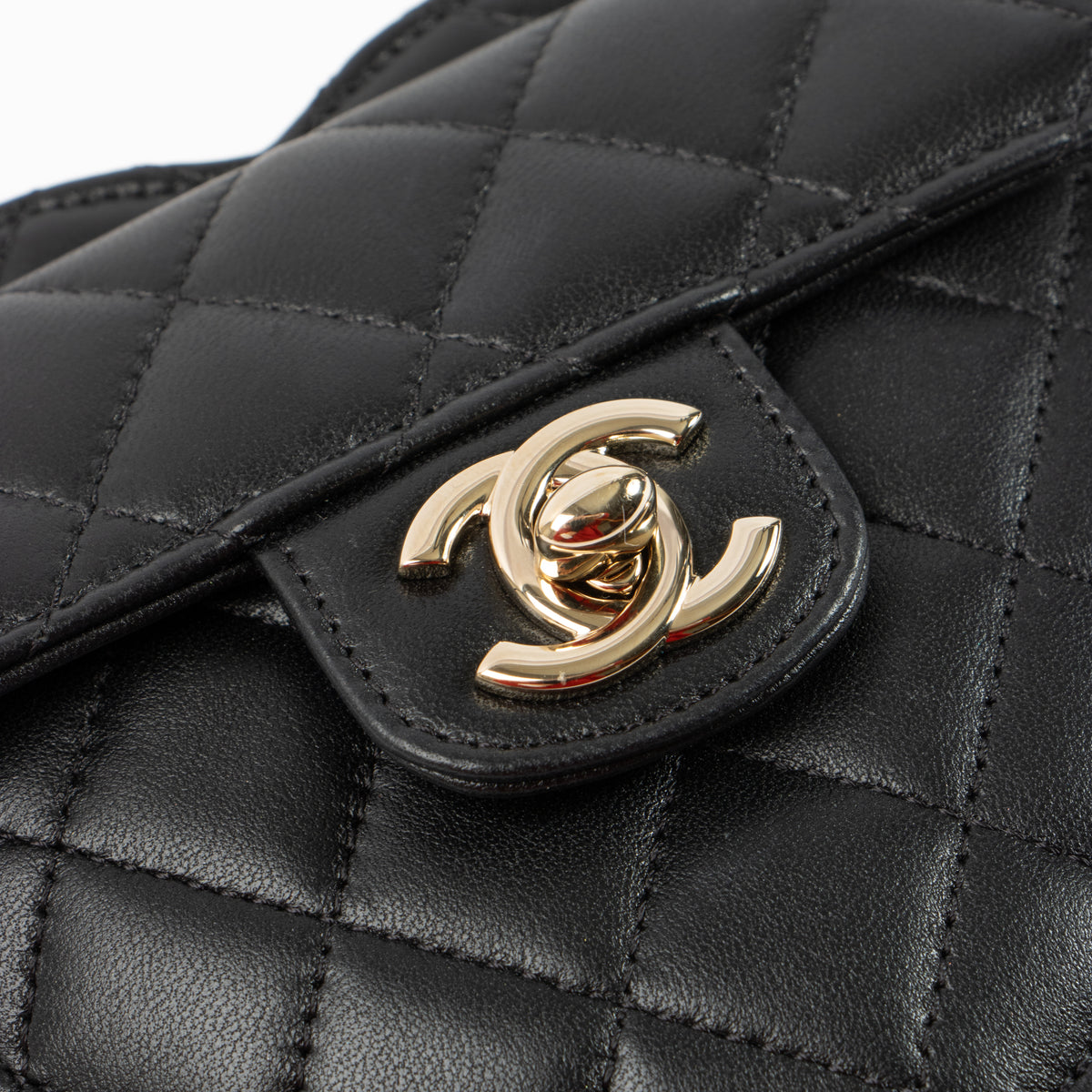 Shop this authentic Chanel Black Quilted Lambskin CC In Love Heart Clutch With Chain pre-loved on labellov.com