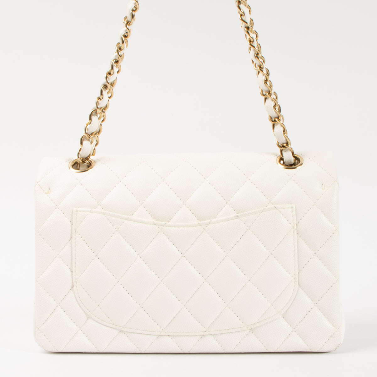 Shop this authentic Chanel White Caviar Small Classic Handbag pre-loved on Labellov.com