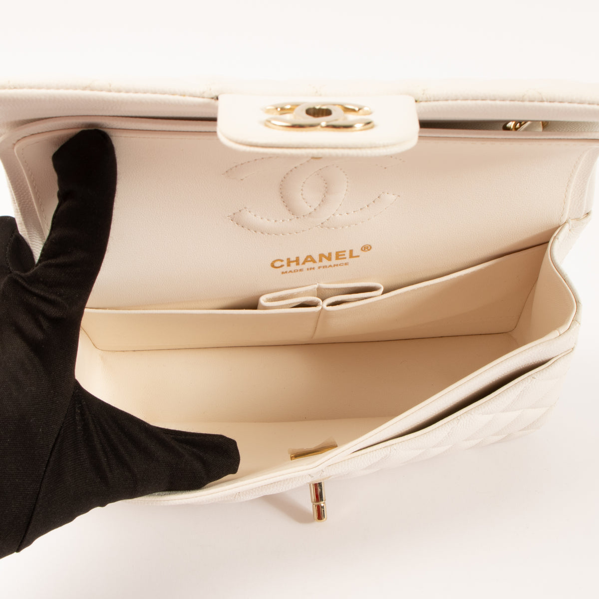 Shop this authentic Chanel White Caviar Small Classic Handbag pre-loved on Labellov.com