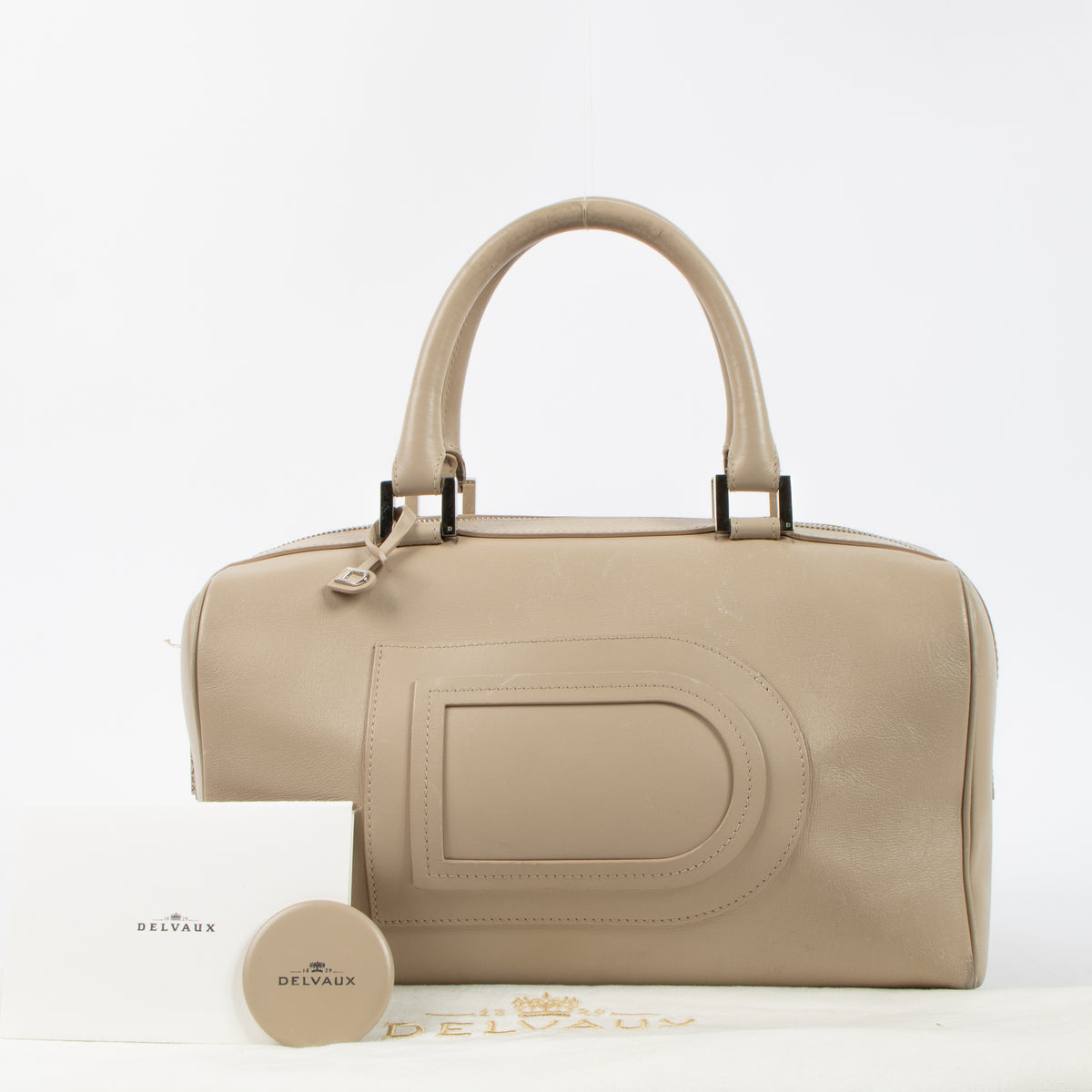 Shop this authentic Delvaux Sand Allure Louise Boston Bag pre-loved on Labellov.com