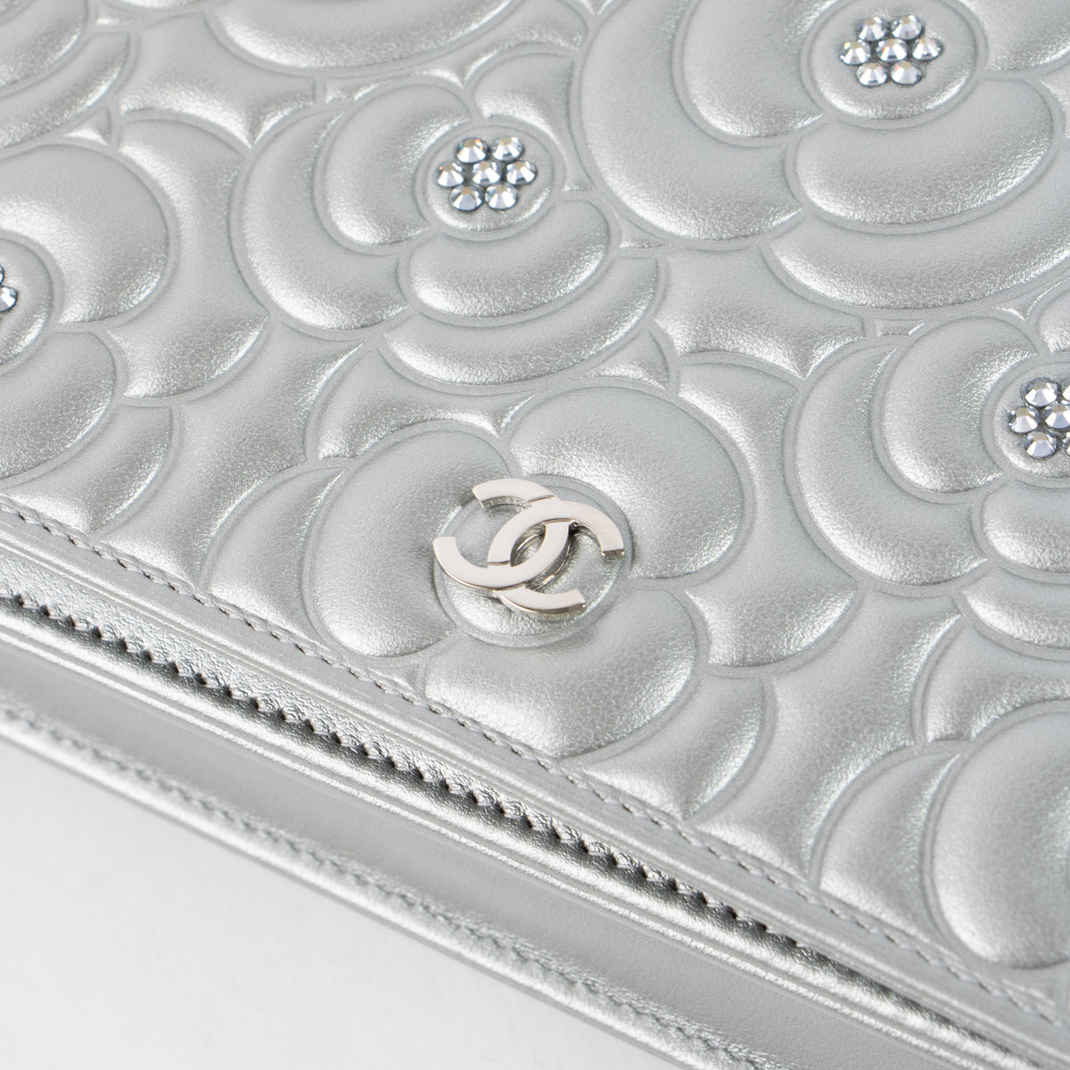 Shop this authentic Chanel Silver Diamante Crystal Camellia Quilted Wallet On Chain pre-loved on Labellov.com