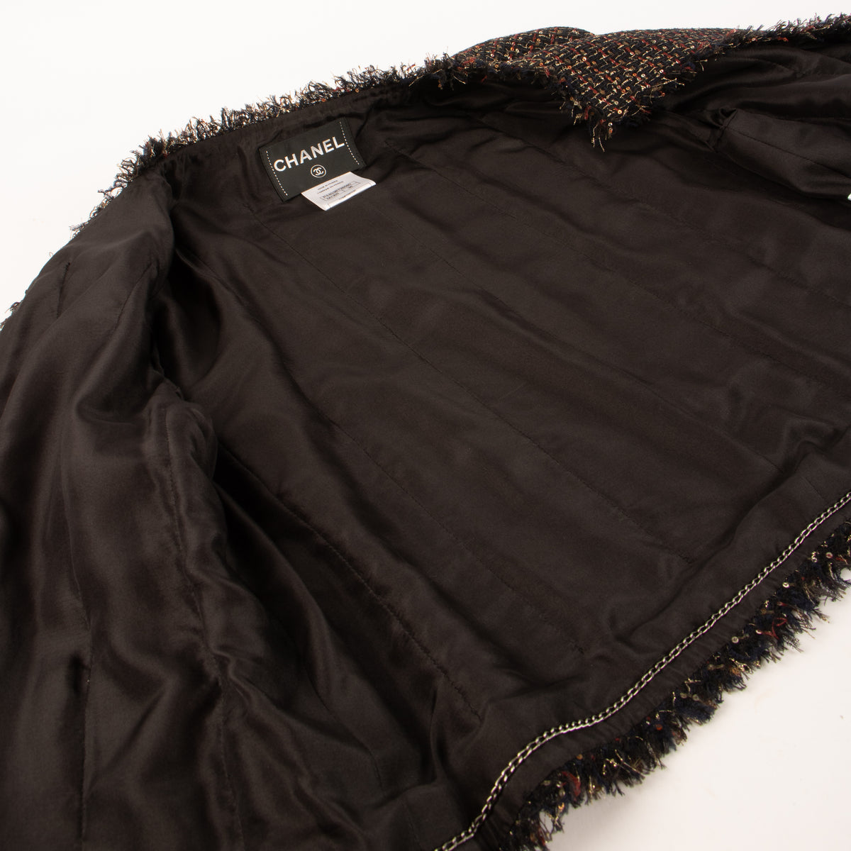 Shop this authentic Chanel 12A Paris-Bombay Black Tweed Jacket pre-loved on Labellov.com