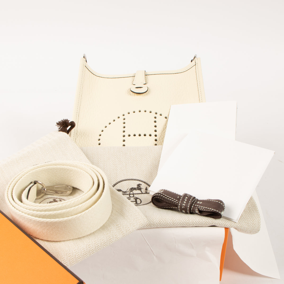 Shop this authentic luxury Hermès Evelyne 16 Cream Clemence PHW Pre-Loved on Labellov.com