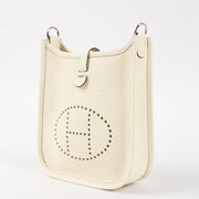 Shop this authentic luxury Hermès Evelyne 16 Cream Clemence PHW Pre-Loved on Labellov.com