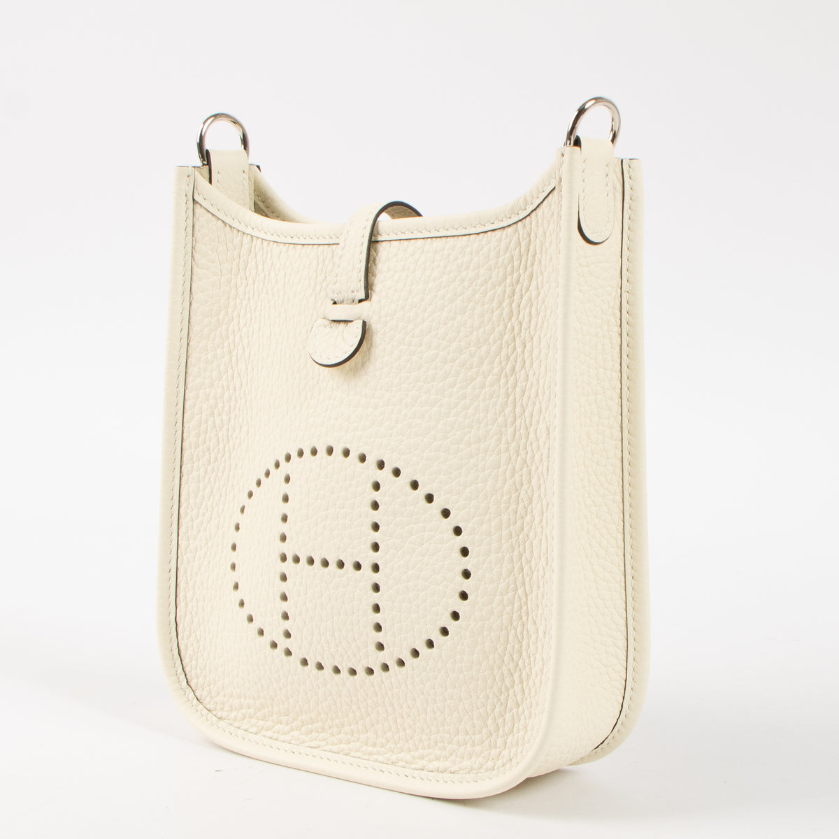 Shop this authentic luxury Hermès Evelyne 16 Cream Clemence PHW Pre-Loved on Labellov.com