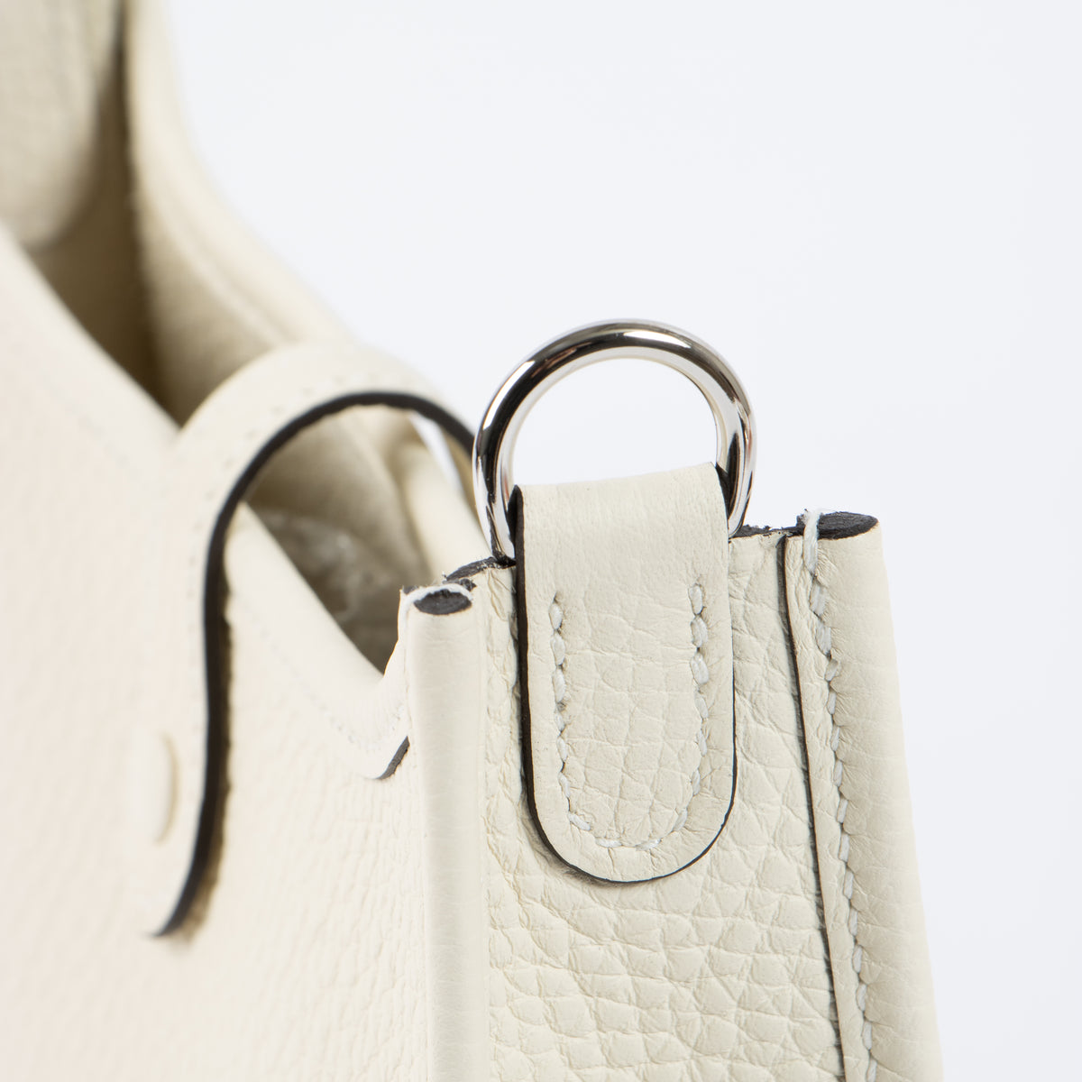 Shop this authentic luxury Hermès Evelyne 16 Cream Clemence PHW Pre-Loved on Labellov.com