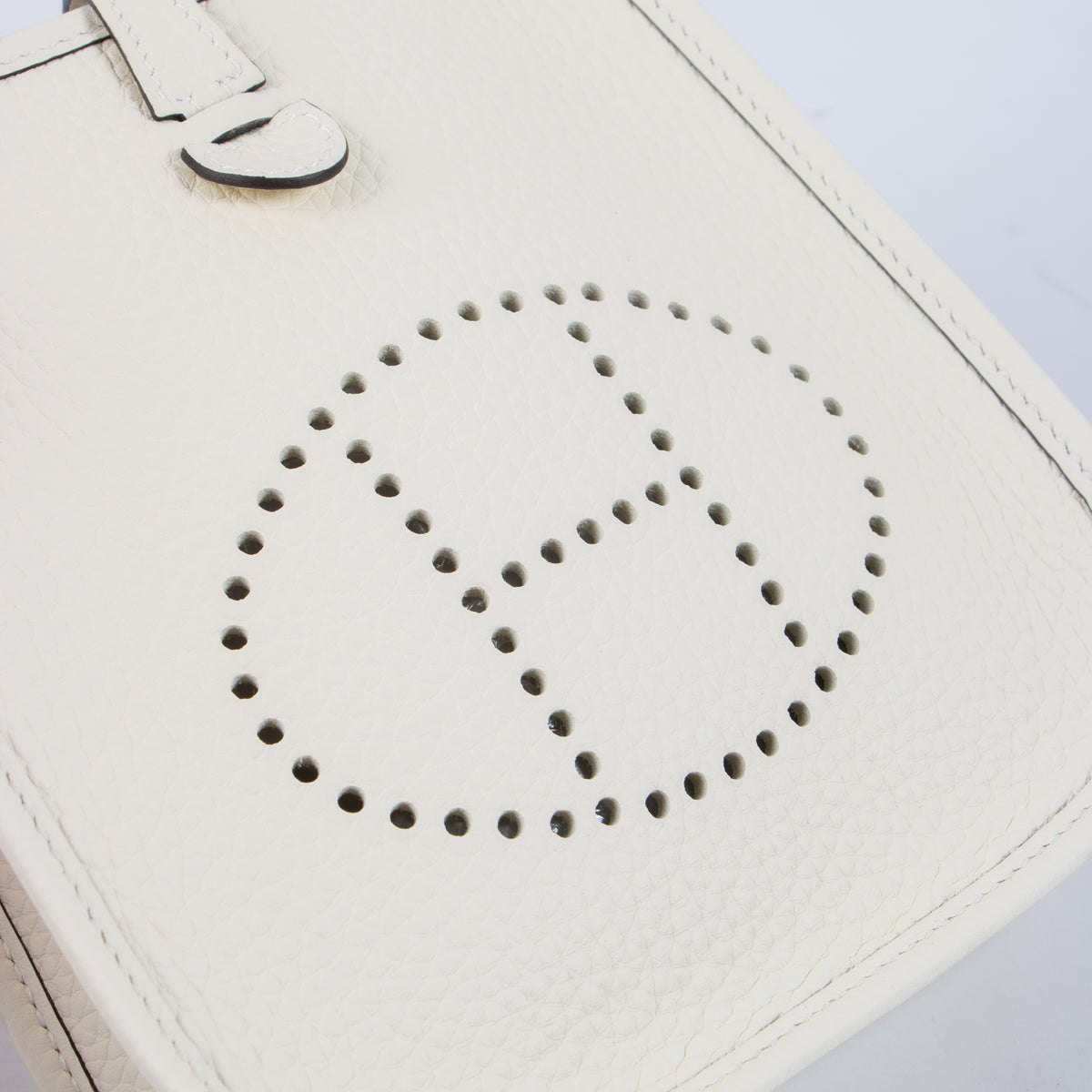Shop this authentic luxury Hermès Evelyne 16 Cream Clemence PHW Pre-Loved on Labellov.com