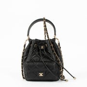 Shop the authentic Chanel 26P Black Mini Bucket Bag With Chain second hand on Labellov.com
