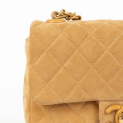 Shop this 100% authentic Chanel Beige Suede Mini Flap Bag at Labellov.com
