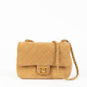 Shop this 100% authentic Chanel Beige Suede Mini Flap Bag at Labellov.com