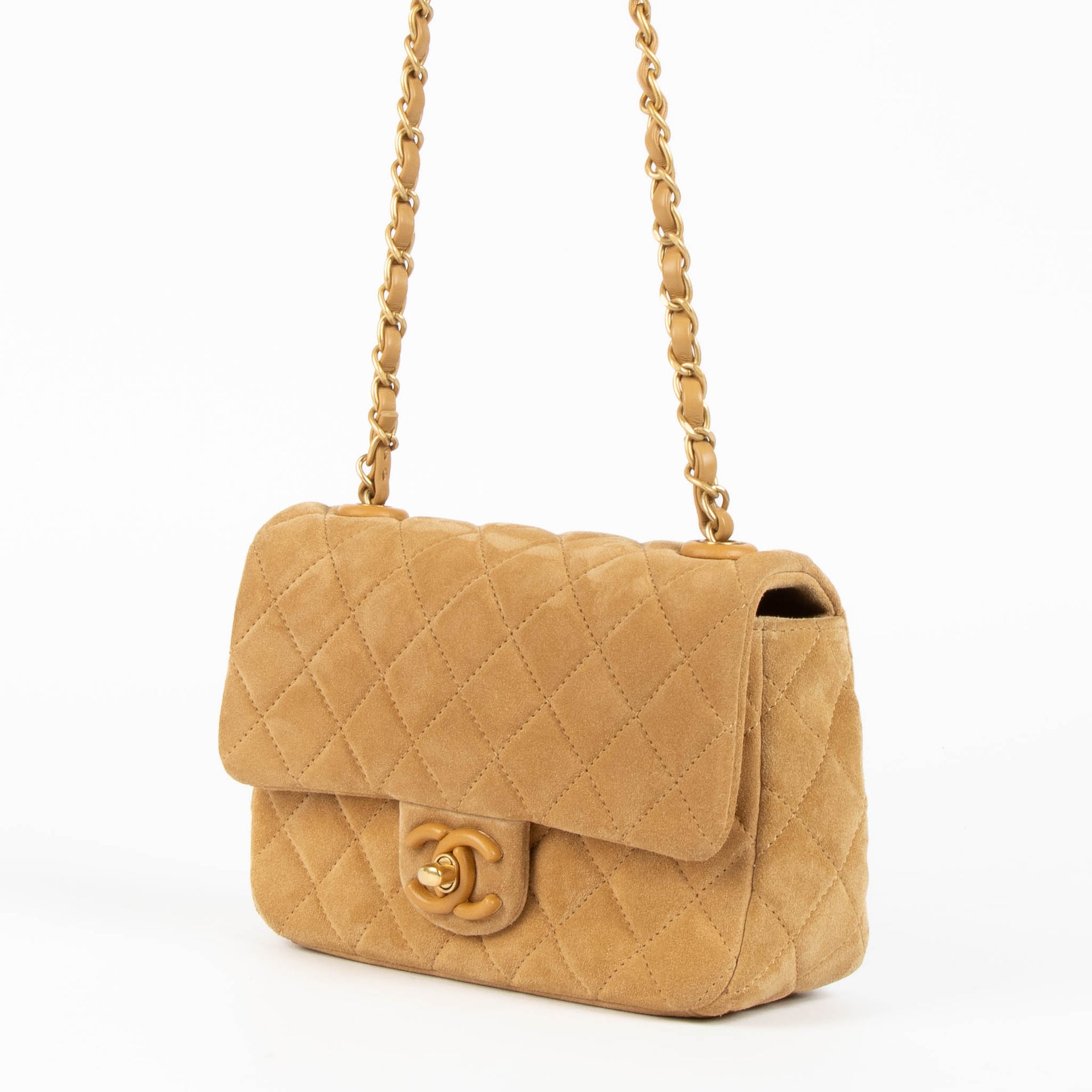 Shop this 100% authentic Chanel Beige Suede Mini Flap Bag at Labellov.com