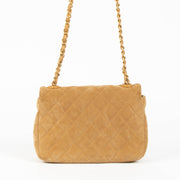 Shop this 100% authentic Chanel Beige Suede Mini Flap Bag at Labellov.com